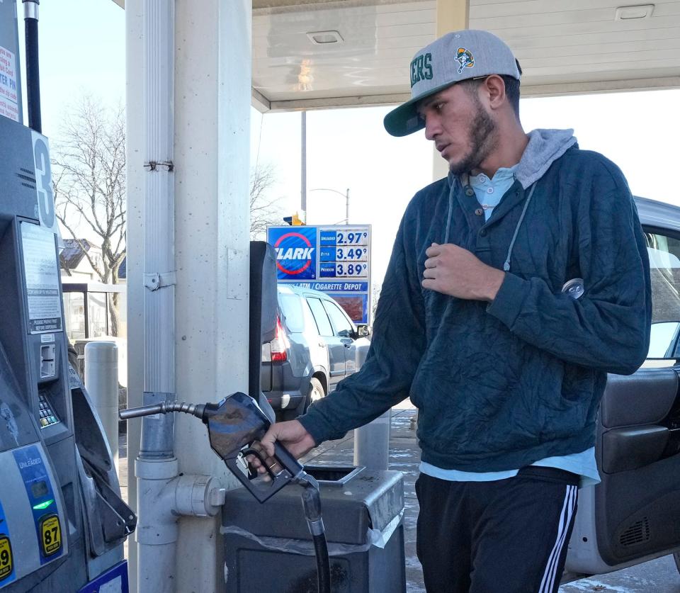 Jesus Garcia of Milwaukee fills up for $2.97 a gallon Monday at the Clark gas station on West Oklahoma Avenue at South 16th Street in Milwaukee. According to GassBuddy.com, for the third straight week, the nation’s average gas price has declined, falling 12.4 cents from a week ago to $3.52 per gallon on Monday.