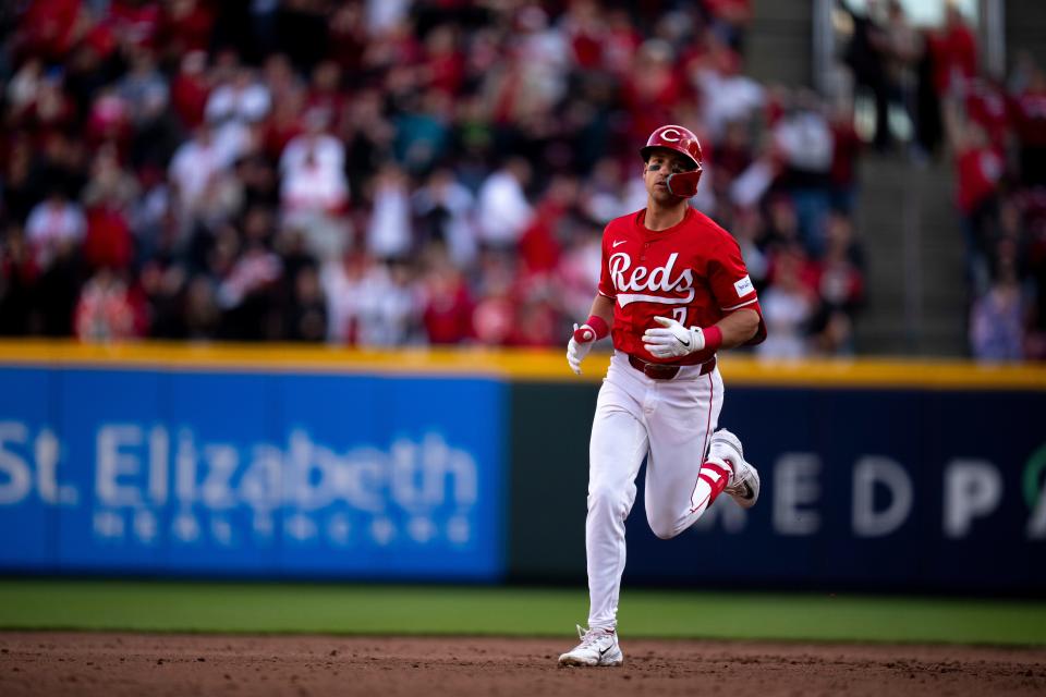 Spencer Steer  rounds the bases after hitting a three-run home run in the eighth inning Saturday. The homer, his third of the season, broke a 5-5 tie and powered the Reds to an eventual 9-6 victory.