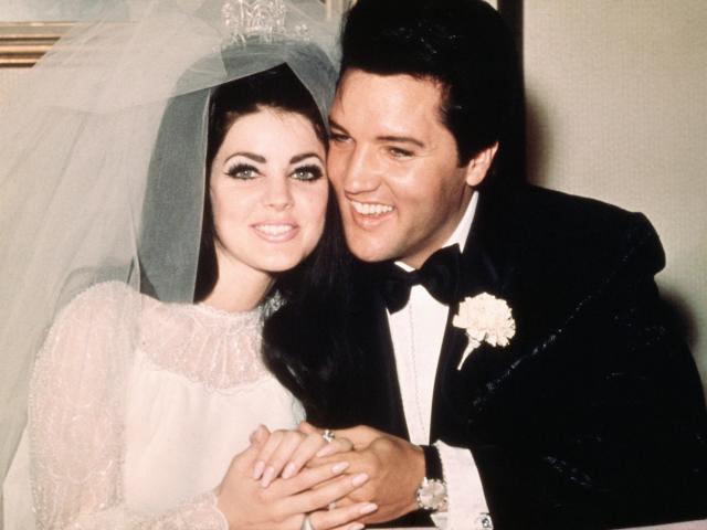 Elvis Presley sits cheek to cheek wit his bride, the former Priscilla Ann Beaulieu, following their wedding May 1, 1967.