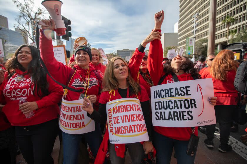 Los Angeles, CA - March 15: A crowd gathered in Grand Park infant of City Hall on Wednesday, March 15, 2023, in Los Angeles, CA. United Teachers of Los Angeles and SEIU 99 members hold a joint rally at Grand Park in a historic show of solidarity. It has been almost ten months since the contract between LAUSD and UTLA has expired, and a staggering three years for SEIU members, leaving almost 60,000 employees vulnerable in the midst of a record-high inflation and a housing crisis. (Francine Orr / Los Angeles Times)