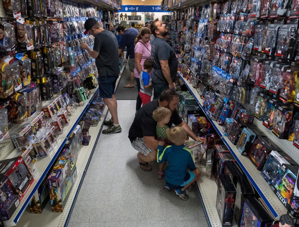 People fill the aisles shopping for toys during the opening day of the new Evansville Toys & Games store Saturday morning, July 10, 2021.