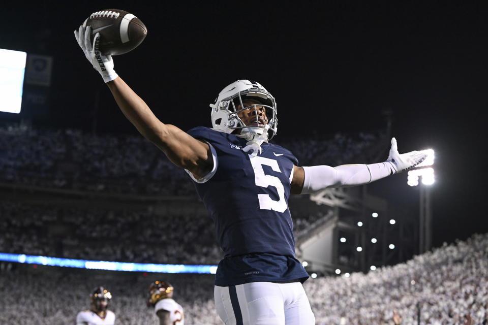 Penn State wide receiver Mitchell Tinsley celebrates a touchdown against Minnesota during the second half of an NCAA college football game Saturday, Oct. 22, 2022, in State College, Pa. Penn State won 45-17. (AP Photo/Barry Reeger)