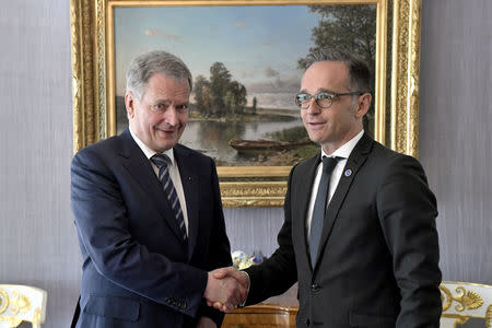 Finland's President Sauli Niinisto shakes hands with Foreign Minister of Germany Heiko Maas at the Presidential Castle in Helsinki, Finland May 17, 2019. Lehtikuva/Vesa Moilanen via REUTERS