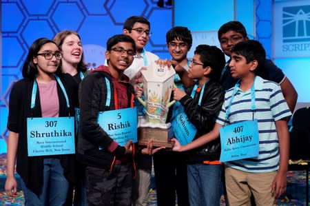 Champions in an eight-way tie celebrate after the final round of the 92nd annual Scripps National Spelling Bee in Oxon Hill, Maryland.