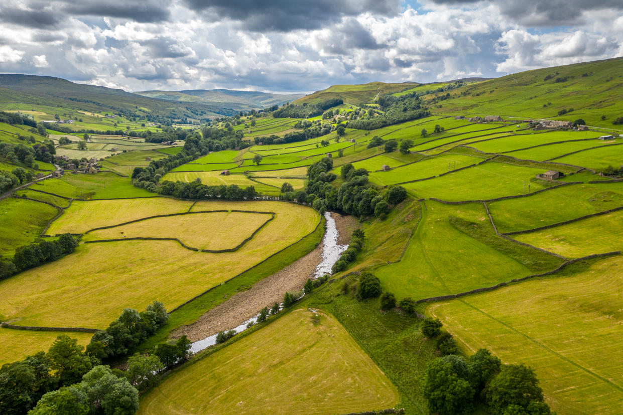 The River Swale snakes through the countryside of Swaledale, Yorkshire.