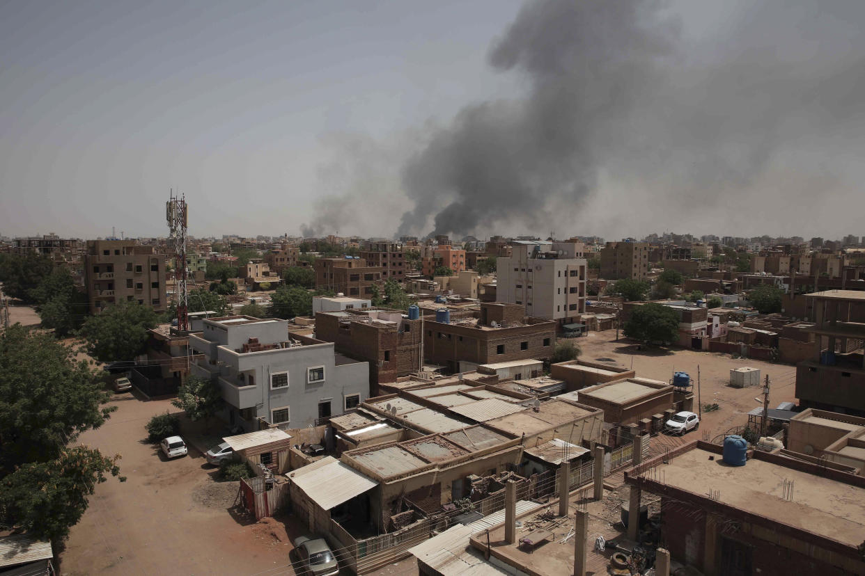 Smoke rises from a central neighborhood of Khartoum, Sudan, Sunday, April 16, 2023, after dozens have been killed in two days of intense fighting. The Sudanese military and a powerful paramilitary group are battling for control of the chaos-stricken nation for a second day.(AP Photo/Marwan Ali)