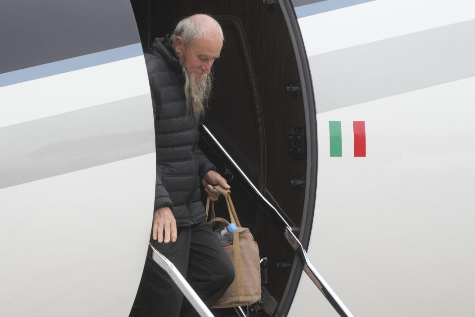 Rocco Antonio Langone gets off a plane after arriving with his wife Maria Donata Caivano and his son Giovanni at Ciampino at military airport, in Rome, Tuesday, Feb. 27, 2024. The Italian family who was kidnapped by an al Qaida-linked group on May 19, 2022 in their home on the outskirts of the city of Koutiala, south-east of the capital of Mali, Bamako, were freed last night, the Italian Foreign Ministry said.(AP Photo/Gregorio Borgia)