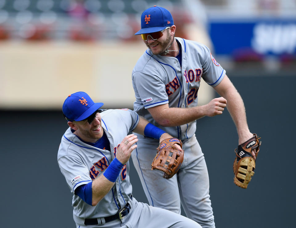 MINNEAPOLIS, MN - JULY 17: Todd Frazier #21 and Pete Alonso #20 of the New York Mets celebrate defeating the Minnesota Twins after the interleague game on July 17, 2019 at Target Field in Minneapolis, Minnesota. The Mets defeated the Twins 14-4. (Photo by Hannah Foslien/Getty Images)