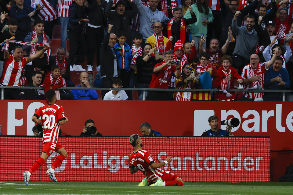 Girona's Taty Castellanos, center, celebrates after scoring his side's opening goal during a Spanish La Liga soccer match between Girona and Real Madrid, at the Montilivi stadium in Girona, Spain, Tuesday, April 25, 2023. (AP Photo/Joan Monfort)