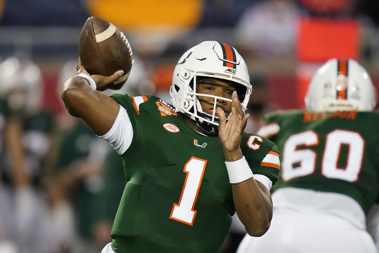 Miami quarterback D'Eriq King looks for a receiver against Oklahoma State during the first half of the Cheez-it Bowl NCAA college football game, Tuesday, Dec. 29, 2020, in Orlando, Fla. (AP Photo/John Raoux)