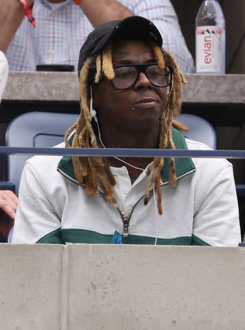 <p>Al Bello/Getty</p> Lil Wayne at the 2023 US Open men's final