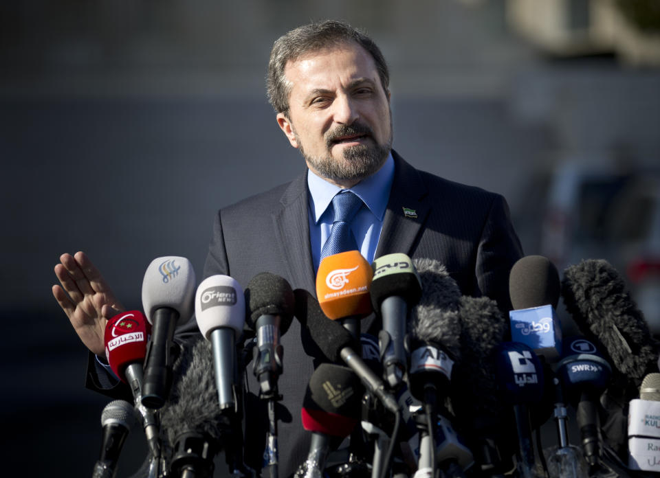 Louay Safi, spokesperson for the Syrian National Coalition, Syria's main political opposition group, gestures as he talks to journalists after a meeting with the Syrian government at the United Nations headquarters in Geneva, Switzerland, Switzerland, Tuesday, Feb 11, 2014. A second round of peace talks between the Syrian government and the opposition bogged down quickly Tuesday in recriminations about who was responsible for escalating violence that has killed hundreds in the past few days and disrupted food aid for trapped civilians. (AP Photo/Anja Niedringhaus)