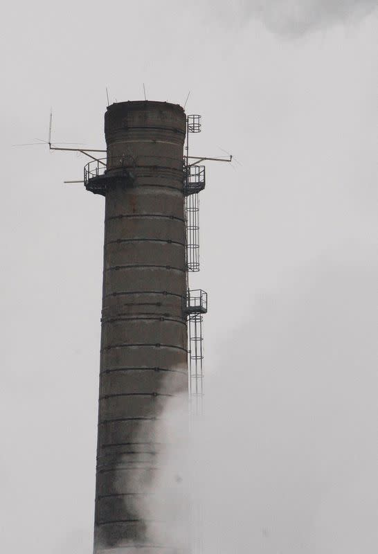 FILE PHOTO: Water vapour billows from smokestacks at the Smurfit Kappa Cellulose du Pin plant in Facture