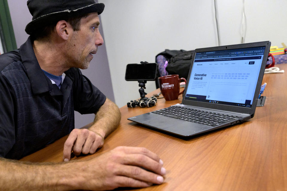 Paul Carpenter, a New Orleans magician, describes using his computer and AI software during an interview in New Orleans, Friday, Feb. 23, 2024. Carpenter says he was hired in January by Steve Kramer, who has worked on ballot access for Democratic presidential candidate Dean Phillips, to use AI software to imitate President Joe Biden's voice to convince New Hampshire Democrat voters not to vote in the state's presidential primary. (AP Photo/Matthew Hinton)