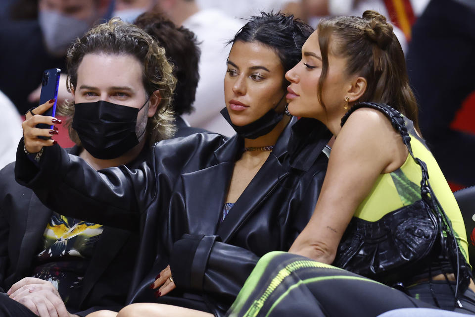 Fans take a selfie during the first half between the Miami Heat and the Washington Wizards at FTX Arena on December 28, 2021 in Miami, Florida, amid the COVID-19 pandemic. (Photo by Michael Reaves/Getty Images)