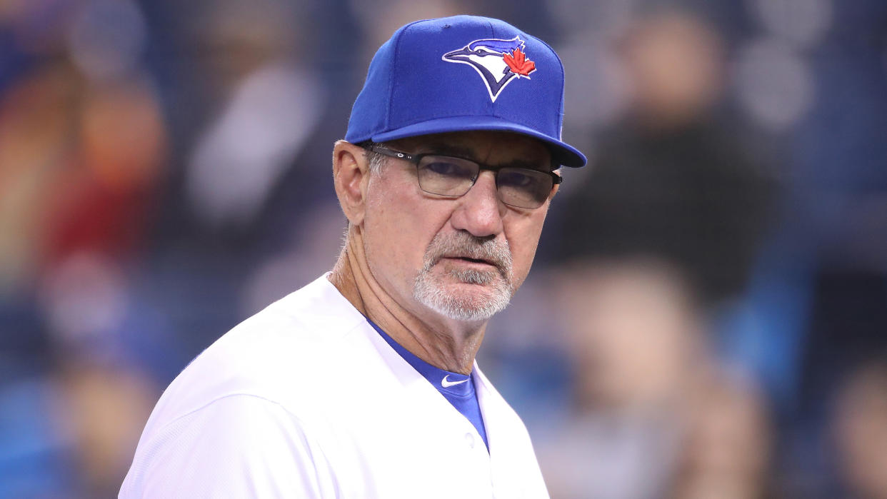 TORONTO, ON - APRIL 02: Bench coach Dave Hudgens #39 of the Toronto Blue Jays walks back to the dugout after delivering the lineup card at home plate before the start of MLB game action against the Baltimore Orioles at Rogers Centre on April 2, 2019 in Toronto, Canada. (Photo by Tom Szczerbowski/Getty Images)