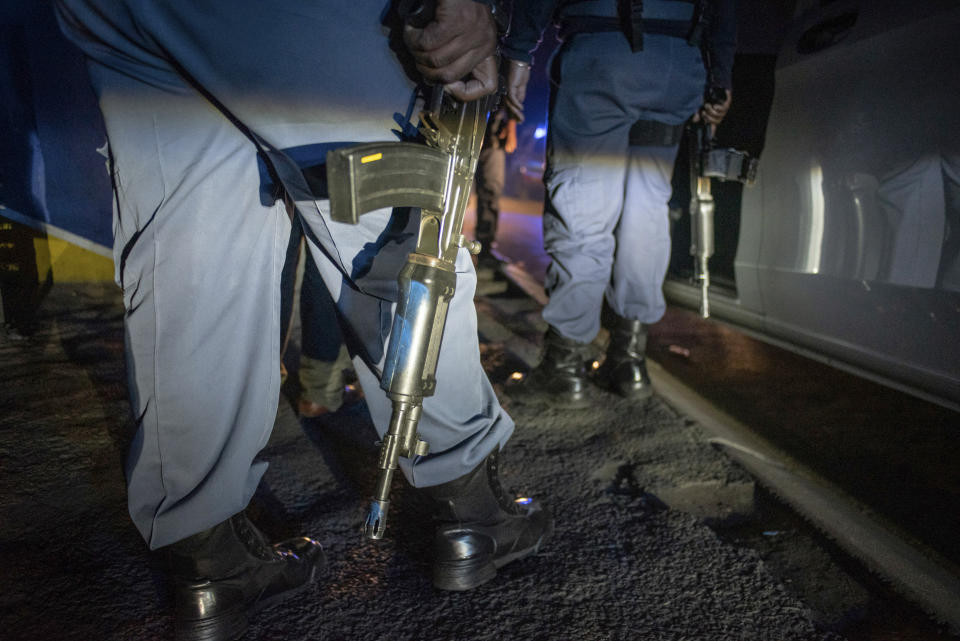 Police patrol an area in Soweto, South Africa, Tuesday, July 12, 2022 in search of illegal firearms following the weekend shooting in a bar which claimed the lives of 16 people. South African police are searching for illegally-held guns in patrols of Johannesburg's Soweto township, following a spate of bar shootings that have rocked the nation. (AP Photo)