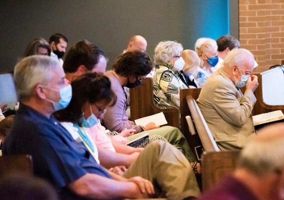 Church members read their Bibles during the Easter Sunday service at the Knoxville First Church of God on April 4, 2021. The congregation celebrated Easter in person after missing similar services in 2020 because of the COVID-19 pandemic.