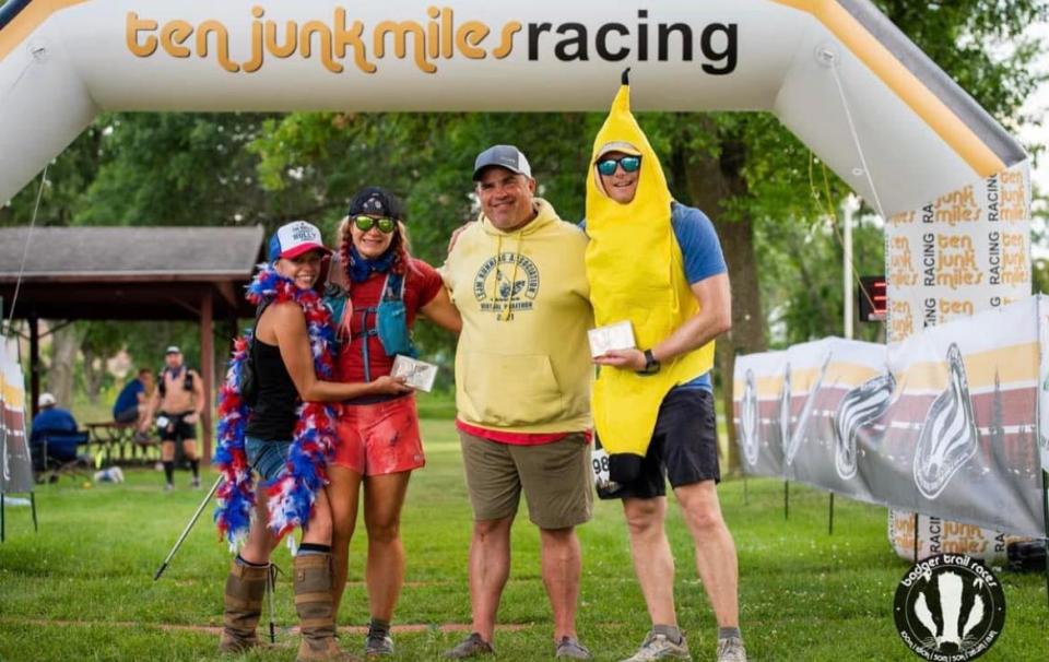 Runners pose at Ten Junk Miles' Badger Trail Races event in Belleville, Wis.