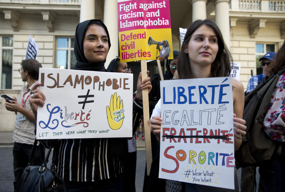 Women join a demonstration organized by 'Stand up to Racism' outside the French Embassy in London on Aug. 26, 2016, against the burkini ban on French beaches.