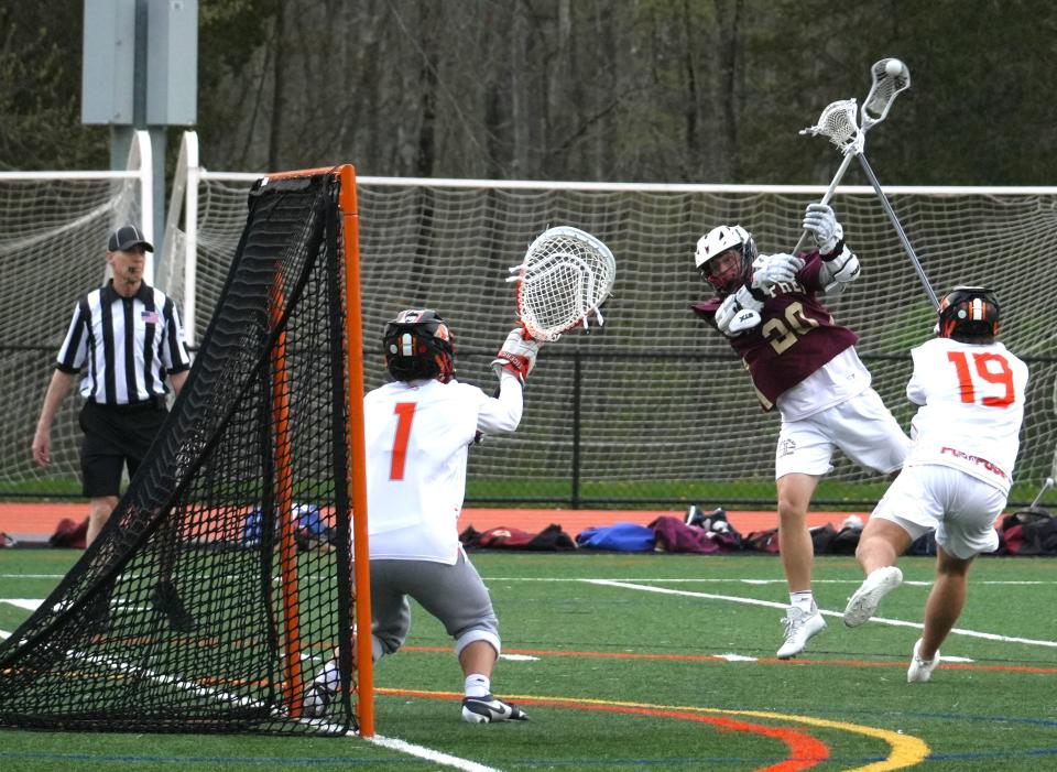 Iona Prep attackman Tim Plunkett unleashes a lefty jump shot for a goal against Ridgefield, Conn. on April 29, 2024. The sophomore netted five goals in a 11-10 overtime loss to the Tigers at Ridgefield High School.