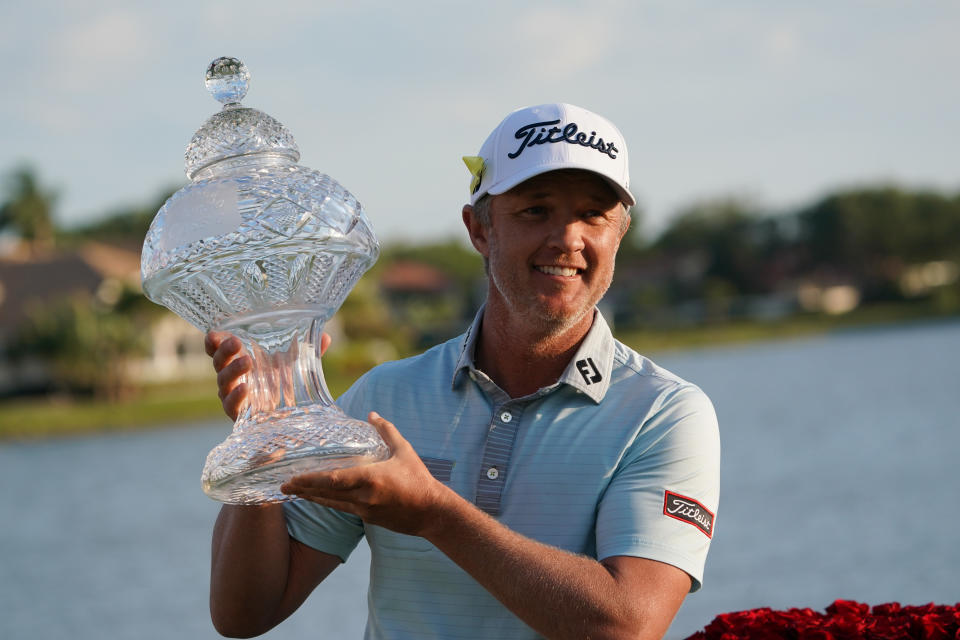 Matt Jones (pictured) raises the trophy after he wins the Honda Classic on March 21, 2021.
