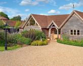 <p> Opting for a large sweep of gravel at the front of your home? It can be super practical, especially if you need plenty of space for parking.  </p> <p> But, it's a good idea to balance out all that hard landscaping material by adding plenty of greenery to the view. The result will be a softer and more welcoming scheme – not to mention more colorful. And if you go for taller plants, it can add a sense of privacy, too. </p> <p> You don't have to stick to straight lines with your design. Try adding flowerbeds and perhaps a small lawn in curved shapes instead, bordered by a smart edge for extra definition. It's a beautiful approach for your front garden. </p>