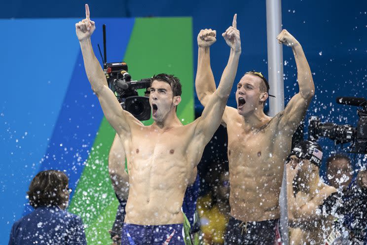 Michael Phelps and Caeleb Dressel of the United States celebrate winning gold in the Final of the Men's 4 x 100m Freestyle Relay on Day 2 of the Rio 2016 Olympic Games at the Olympic Aquatics Stadium on August 7, 2016 in Rio de Janeiro, Brazil. (Lucas Oleniuk/Toronto Star via Getty Images)