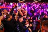 <p>Yancy Reyes celebrates with friends after defeating Eneorji Brooks in the 19th Precinct Grudge Match at the NYPD Boxing Championships at the Hulu Theater at Madison Square Garden on March 15, 2018. (Gordon Donovan/Yahoo News) </p>