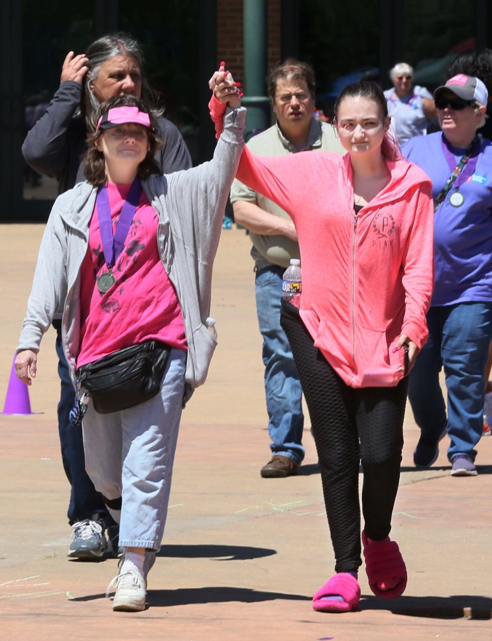 Tracy Dean, a cancer survivor, and her daughter Brianna, both of Cuyahoga Falls, join the walk.