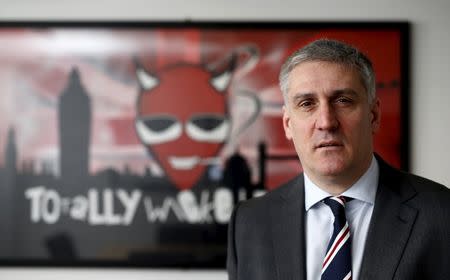 Fraser Cropper, chief executive of British e-cigarette company Totally Wicked, poses for a photograph at the company's office in Blackburn, northern England March 19, 2015. REUTERS/Phil Noble