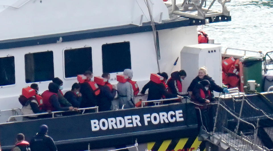 A group of people thought to be migrants are brought in to Dover, Kent, onboard a Border Force vessel following a small boat incident in the Channel. Picture date: Friday October 14, 2022. (Photo by Gareth Fuller/PA Images via Getty Images)