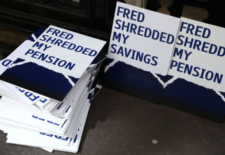 Placards are stacked outside of the Royal Courts as Bank of Scotland (RBS) pursued last-minute settlement talks with a group of investorsto avoid a potentially embarrassing trial over allegations the lender misled them about a 2008 capital increase, in London in London, Britain May 22, 2017. REUTERS/Neil Hall