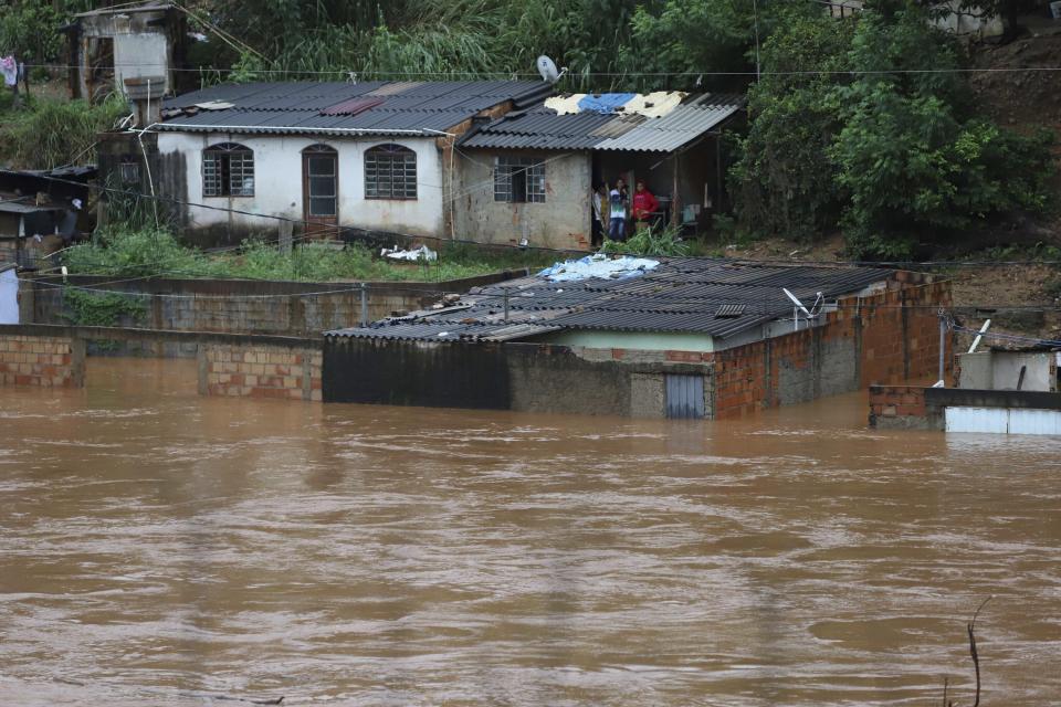 A view of flooded houses caused by heavy rains in Sabara municipality, Minas Gerais state, Brazil, Friday, Jan.24, 2020. Heavy rains caused flooding and landslides in southeast Brazil, killing at dozens of people, authorities said Saturday. (AP Photo/Flavio Tavares-Futura Press)