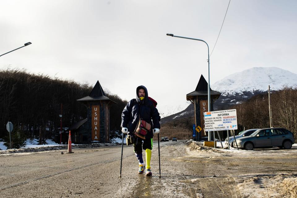 Venezuelan Yeslie Aranda, 57, makes good on his promise to travel throughout South America with one leg and a prosthesis as he enters the southernmost city in the world, Ushuaia, Argentina, Saturday, Aug. 17, 2019.