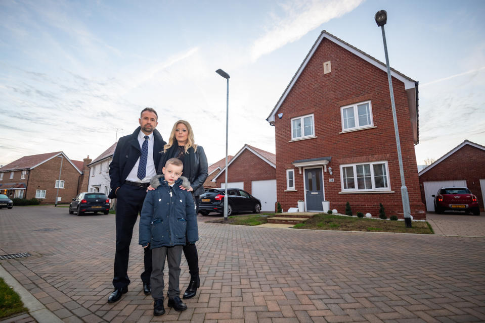 Steve Price 41, with his wife Louise Price ,40 and son Charlie Price age 6 outside their home in Maldon, Essex. A family is at war with housing developers over two lamp posts installed in the middle of the front garden of their Â£400k home.  See SWNS story SWTPlampost.  Steve Price, 41, has been at loggerheads with developers Crest Nicholson for three years in a complex legal battle.  It started when the builders installed a new lamp post on the wrong side of his front door - and demanded it be moved 5.6m to the left.  While uncovering the mistake, Steve and his wife Louise, 40, discovered they had been short changed - their lawn was 90cm shorter than it should be.  Crest Nicholson offered the family Â£15,000 compensation for the lost land, and to buy a strip of land the council now needed for lamp post maintenance.  But when Steve raised concerns about how much of his lawn would be lost to paving around the post, he claims Crest Nicholson withdrew the cash offer.  Instead the housing company said it had struck a deal with the council over the access strip.