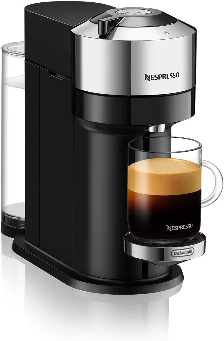 the nespresso machine with a cup of full coffee on it