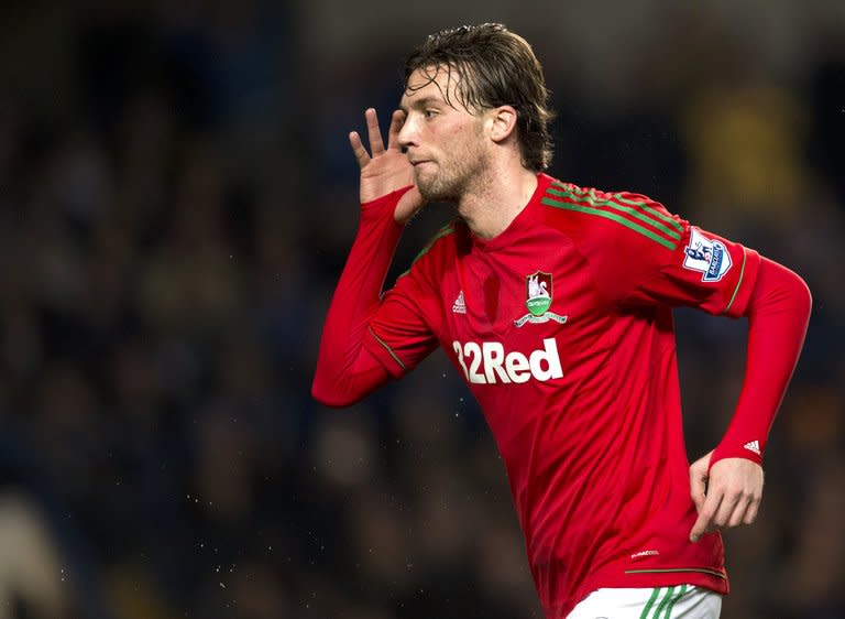 Swansea City's Michu scores the opening goal against Chelsea in their League Cup semi-final first leg at Stamford Bridge on January 9, 2013. Manager Michael Laudrup has insisted Michu will stay with Swansea during the January transfer window after the Spanish striker put his side in sight of a place in the final