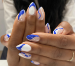 <p>This look will last long after the Fourth of July ends. The abstract design is vibrant, making this an unforgettable style. </p><p><a href="https://www.amazon.com/Polish-Glossy-Finish-Butler-Please/dp/B00GJ782FI/ref=sr_1_5_mod_primary_new?keywords=royal+blue+nail+polish&qid=1653260466&sbo=RZvfv%2F%2FHxDF%2BO5021pAnSA%3D%3D&sprefix=royal+blue+nail%2Caps%2C106&sr=8-5&tag=syn-yahoo-20&ascsubtag=%5Bartid%7C10055.g.1278%5Bsrc%7Cyahoo-us" rel="nofollow noopener" target="_blank" data-ylk="slk:SHOP ROYAL BLUE NAIL POLISH;elm:context_link;itc:0;sec:content-canvas" class="link ">SHOP ROYAL BLUE NAIL POLISH</a></p>