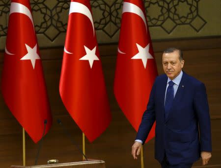 Turkish President Tayyip Erdogan arrives a meeting with mukhtars at the Presidential Palace in Ankara, Turkey, March 16, 2016. REUTERS/Umit Bektas