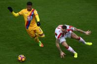 <p>Stoke City’s Marko Arnautovic (right) and Crystal Palace’s Patrick van Aanholt battle for the ball</p>