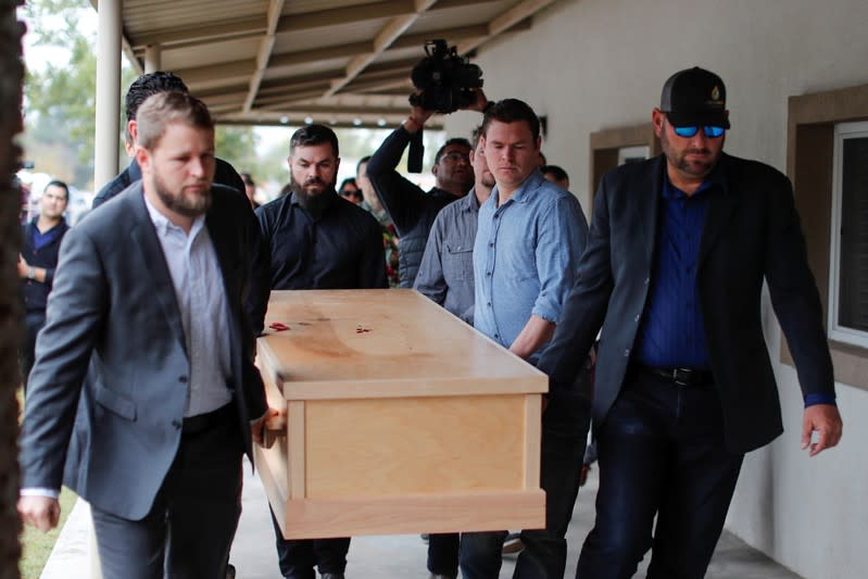 Relatives of Christina Marie Langford Johnson, who was killed by unknown assailants, carry her coffin during the funeral service before a burial at the cemetery in LeBaron, Chihuahua