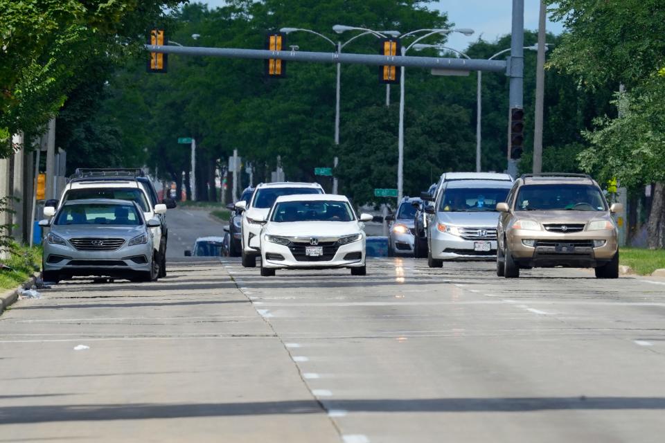 Traffic travels along Capitol Drive near North 61st Street in Milwaukee. To stop traffic from passing in the parking lane, far left, the city is planning to install curb extensions at various intersections along Capitol Drive between 67th and 47th streets.