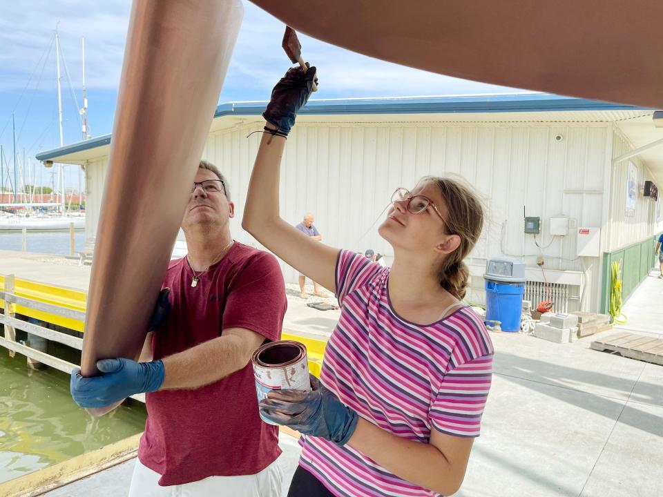 Meghan Hoy and her father Pat Hoy working on Blue Eyes on July 9 in Port Huron in preparation for the 2023 Bayview Mackinac race on July 15.