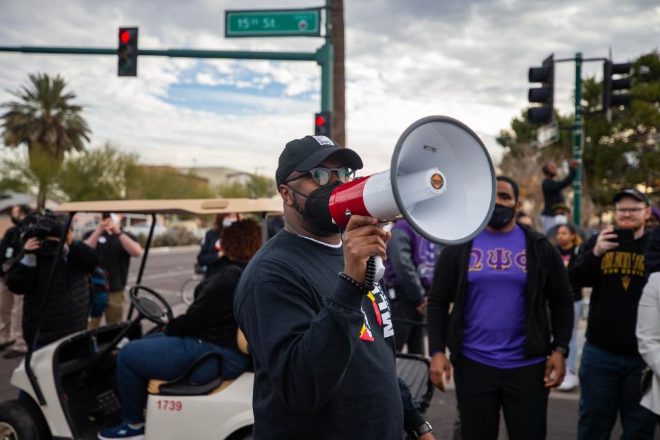 Pilgrim Rest Baptist Church Pastor Terry Mackey speaks before the crowd leaves the church parking lot to march to Margret T. Hance Park for the Arizona Martin Luther King Jr. Day 2022 March in Phoenix on Monday, Jan. 17, 2022.