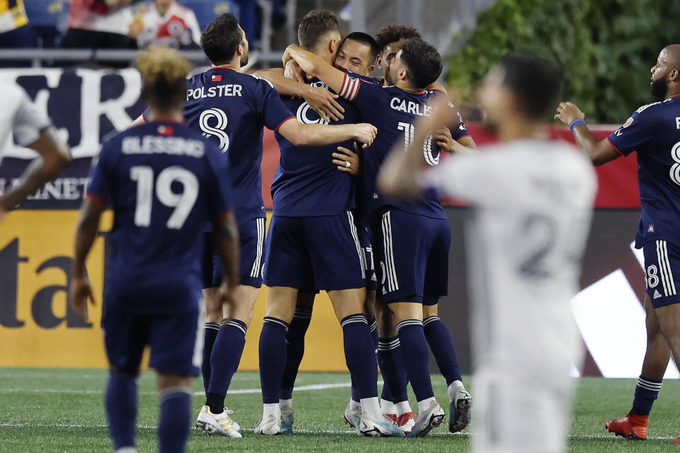 New England Revolution's Giacomo Vrioni (9) celebrates his goal with teammates during the second half of an MLS soccer match against the Toronto FC, Saturday, June 24, 2023, in Foxborough, Mass. (AP Photo/Michael Dwyer)