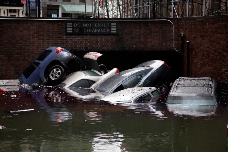 Cars are submerged at the entrance to a parking garage in New York’s Financial District in the aftermath of superstorm Sandy on Oct. 30, 2012.