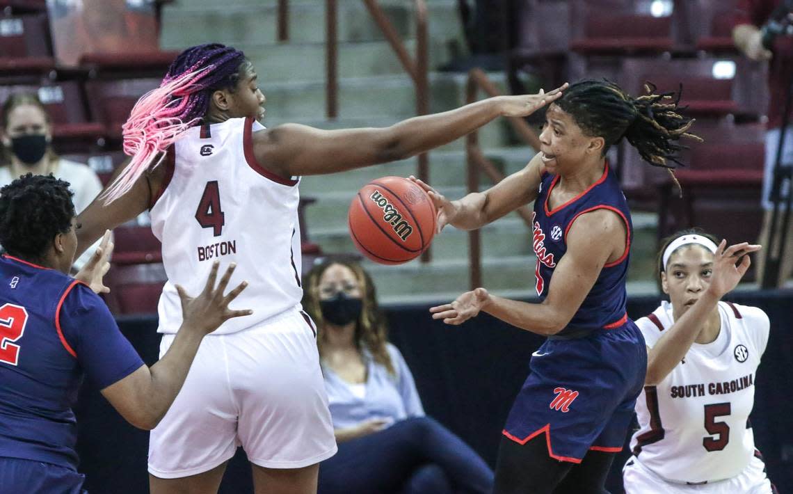 Ole Miss guard Valerie Nesbitt (4) passes around South Carolina Gamecocks forward Aliyah Boston (4) during the first half of action in the Colonial Life Arena in Columbia, S.C.