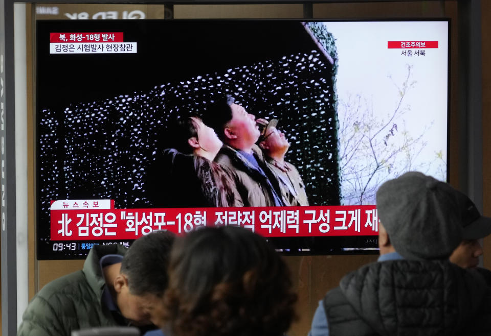 A TV screen shows an image of North Korean leader Kim Jong Un, center, his daughter during a news program at the Seoul Railway Station in Seoul, South Korea, Friday, April 14, 2023. North Korea said Friday it has successfully test-launched a new intercontinental ballistic missile powered by solid propellants, a development that if confirmed could provide the country with a harder-to-detect weapon targeting the continental United States. (AP Photo/Ahn Young-joon)