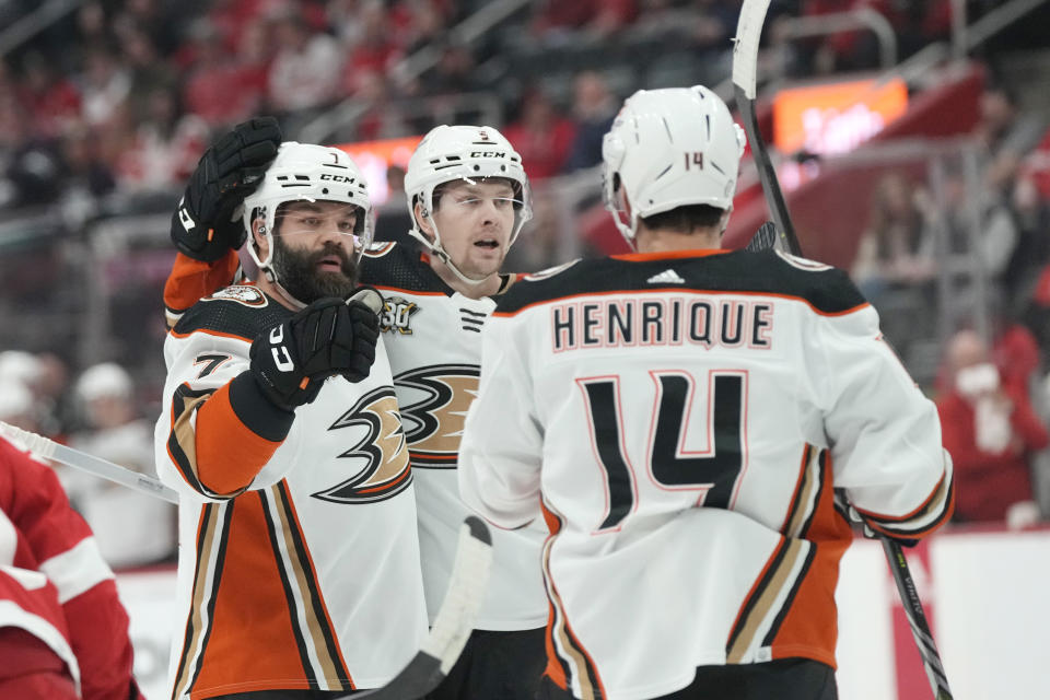 Anaheim Ducks defenseman Radko Gudas, left, is congratulated after his goal during the first period of an NHL hockey game against the Detroit Red Wings, Monday, Dec. 18, 2023, in Detroit. (AP Photo/Carlos Osorio)